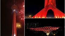 Three iconic structures of Tehran lit up red to mark World AIDS Day