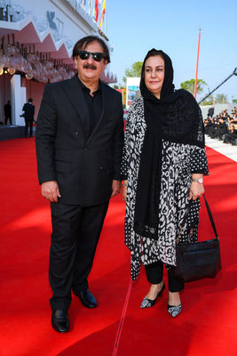 09 Director Majid Majidi and a guest walk the red carpet ahead of the movie Khorshid (Sun Children) at the 77th Venice Film Festival on September 06_ 2020 in Venice_ Italy.2