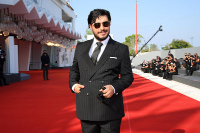 05 Javad Ezzati walks the red carpet ahead of the movie Khorshid (Sun Children) at the 77th Venice Film Festival on September 06_ 2020 in Venice_ Italy.1