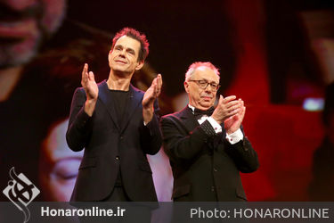 Tom Tykwer and Dieter Kosslick are seen on stage at the closing ceremony during the 68th Berlinale International Film Festival