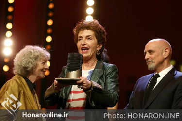 Ruth Beckermann_ winner of the Glashuette Original Documentary Award for _Waldheims Walzer_ poses on stage at the closing ceremony during the 68th Berlinale International Film Festival