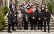 Artists plants tree saplings in Niavaran Cultural Center