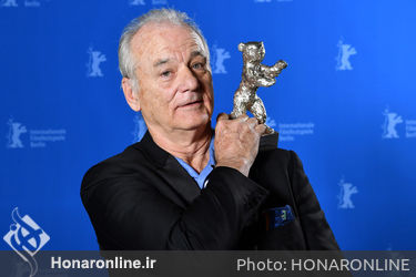 Bill Murray poses with the award he accepted for Wes Anderson_ winner of the Silver Bear for Best Director for _Isle of Dogs__ at the Award Winners photo call during the 68th Berlinale International Film Festival