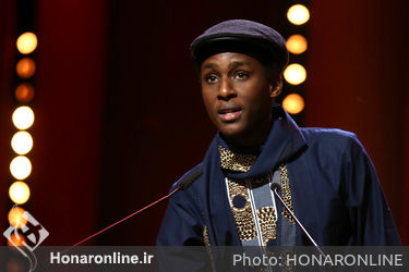 Samuel Ishimwe speaks after receiving the Silver Bear Jury Prize in the short film category for _Imfura_ during the closing ceremony of the 68th Berlinale International Film Festival