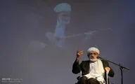 Dotar virtuoso Osman Mohammad-Parast receives a copy of UNESCO certificate