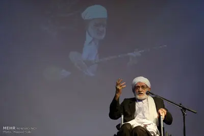 Dotar virtuoso Osman Mohammad-Parast receives a copy of UNESCO certificate