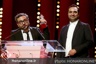 Alonso Ruizpalacios (L) and Manuel Alcala receive the Silver Bear for Best Script for _Museo_ at the closing ceremony during the 68th Berlinale International Film Festival