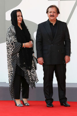 02 Director Majid Majidi and a guest walk the red carpet ahead of the movie Khorshid (Sun Children) at the 77th Venice Film Festival on September 06_ 2020 in Venice_ Italy.1