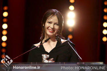 Elena Okopnaya receives the Silver Bear for an Outstanding Artistic Contribution for _Dovlatov_ on stage at the closing ceremony during the 68th Berlinale International Film Festival
